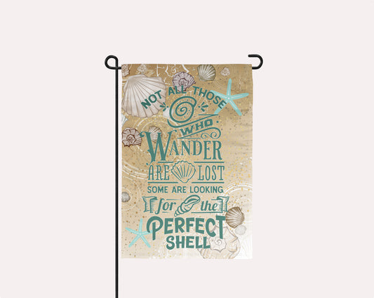 Coastal-inspired garden flag with a sand and shell background print | imperfect by design co