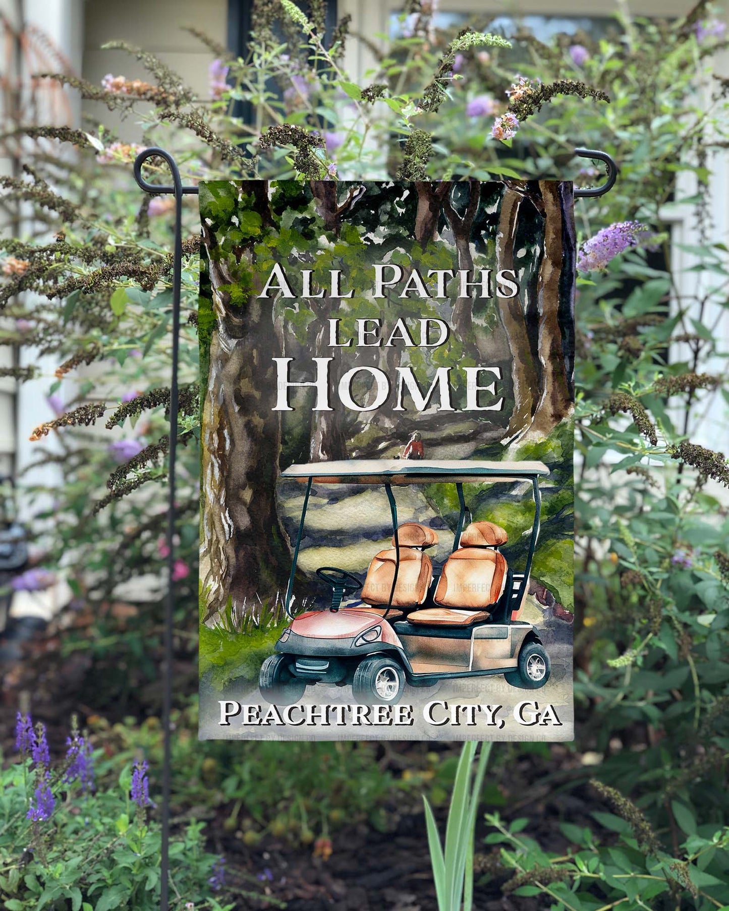 Vibrant 12x18 inch outdoor flag with "All Paths Lead Home" phrase and customized city and state, watercolor style scene with golf cart | imperfect by design co