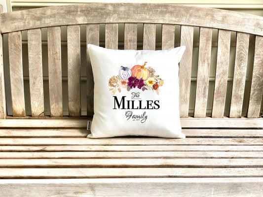 Decorative pillow (cover) with 'The Millers Family' text on a wooden porch bench