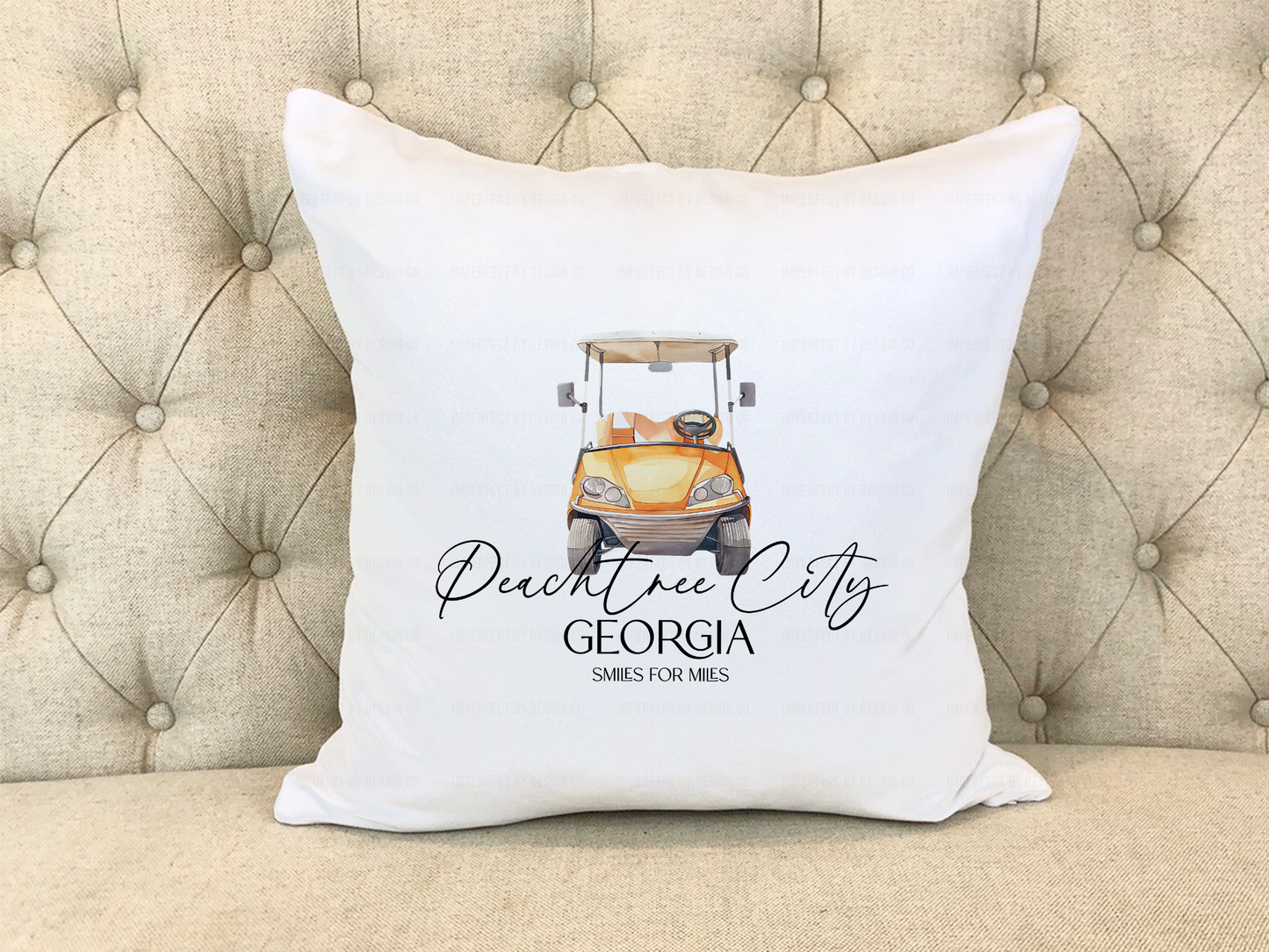 Front view of an orange golf cart with “Smiles for miles” text on the pillow cover.