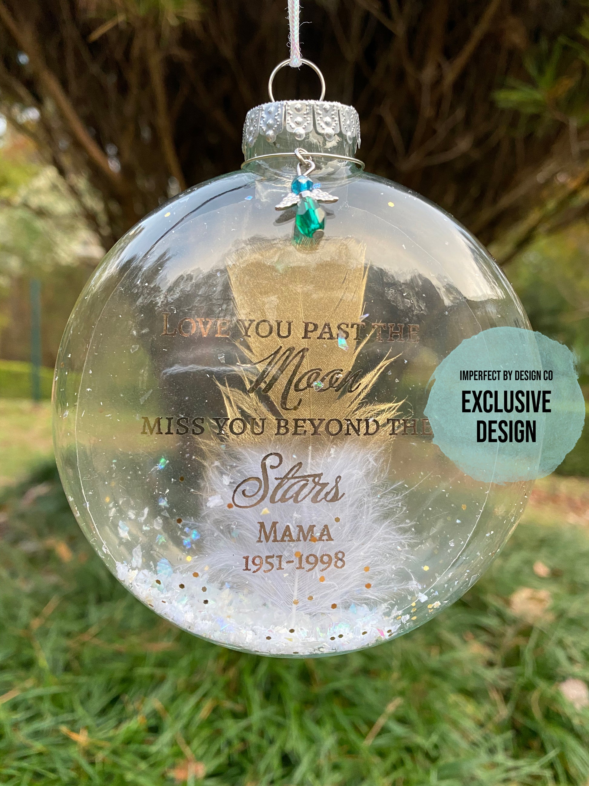 Gold-trimmed feather inside "Love You Past the Moon" personalized ornament