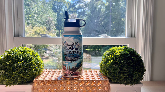 Photo of 32oz Hydro Sports Water Bottle with flip sports nozzle Bottle text reads "I must go moutains are calling me" imperfect by design co exclusive
