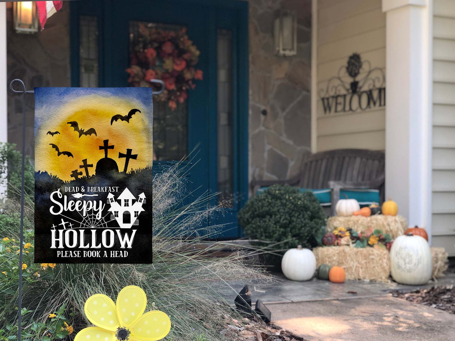 Spooky Sleepy Hollow-themed garden flag with eerie sunset, tombstones, bats, and Halloween décor message.