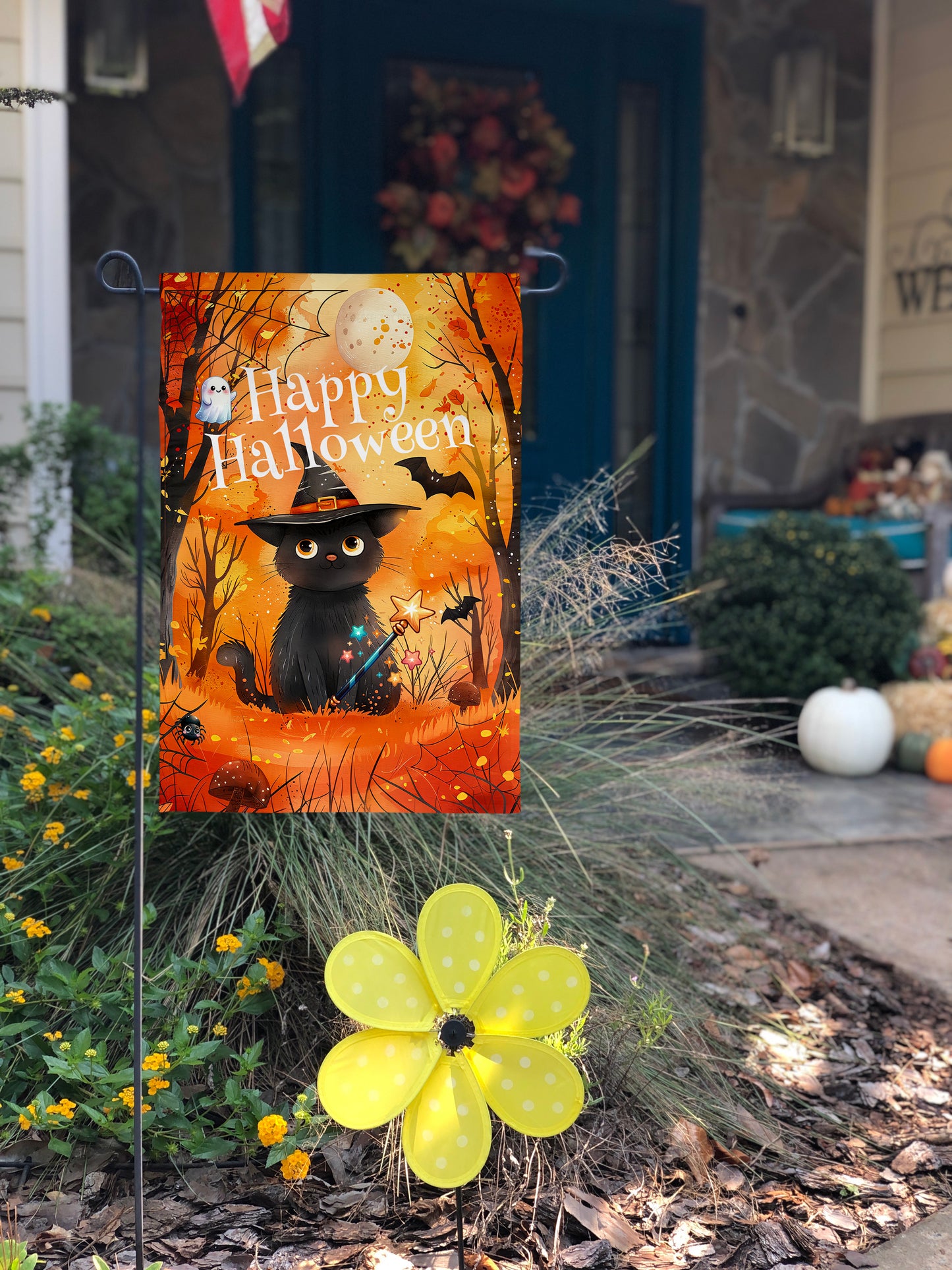 "Happy Halloween" garden flag with a cute black cat in a witch’s hat, bats, and a ghost in a spooky forest.