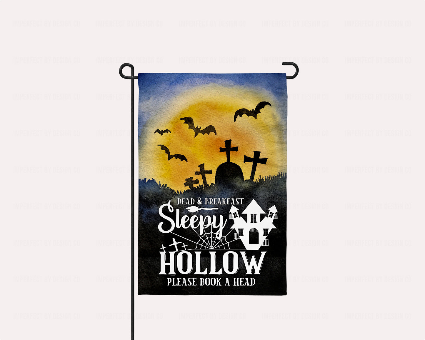 Sleepy Hollow Dead & Breakfast garden flag with a haunted house, graveyard, and flying bats, perfect for Halloween décor