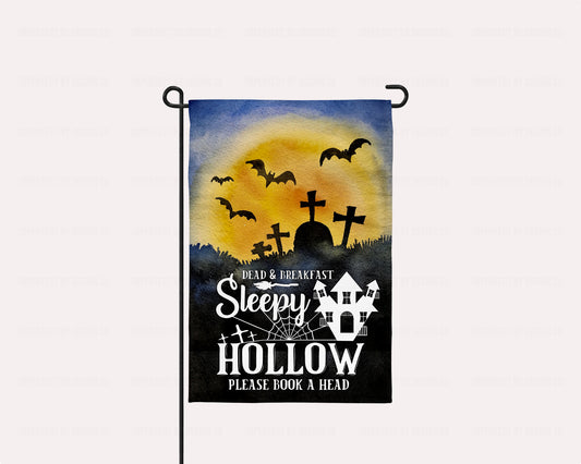 Sleepy Hollow Dead & Breakfast garden flag with a haunted house, graveyard, and flying bats, perfect for Halloween décor