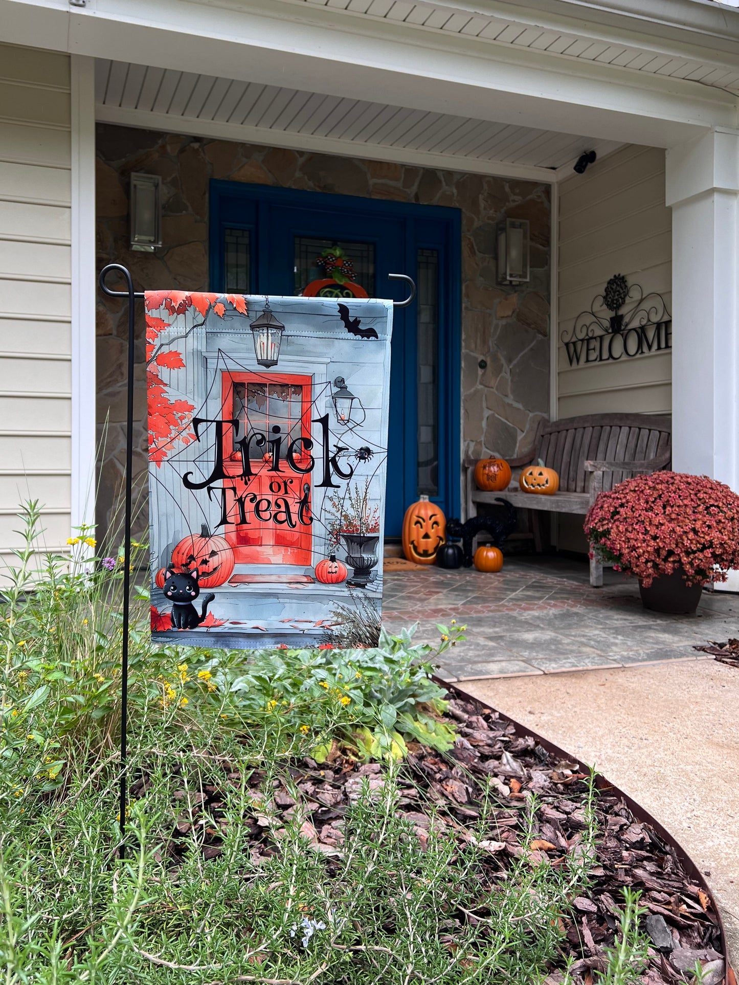 12x18 inch Garden Flag "Trick or Treat" on cobweb Porch with black cat and smiling Jack-O'-Lanterns