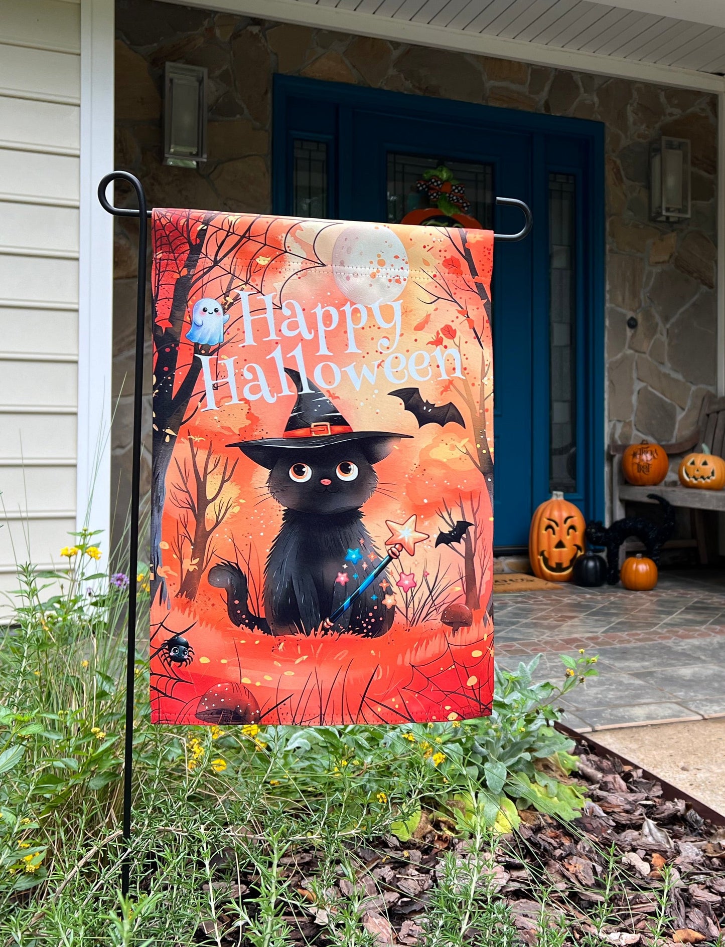 Happy Halloween 12x18 garden flag in fall setting on front porch