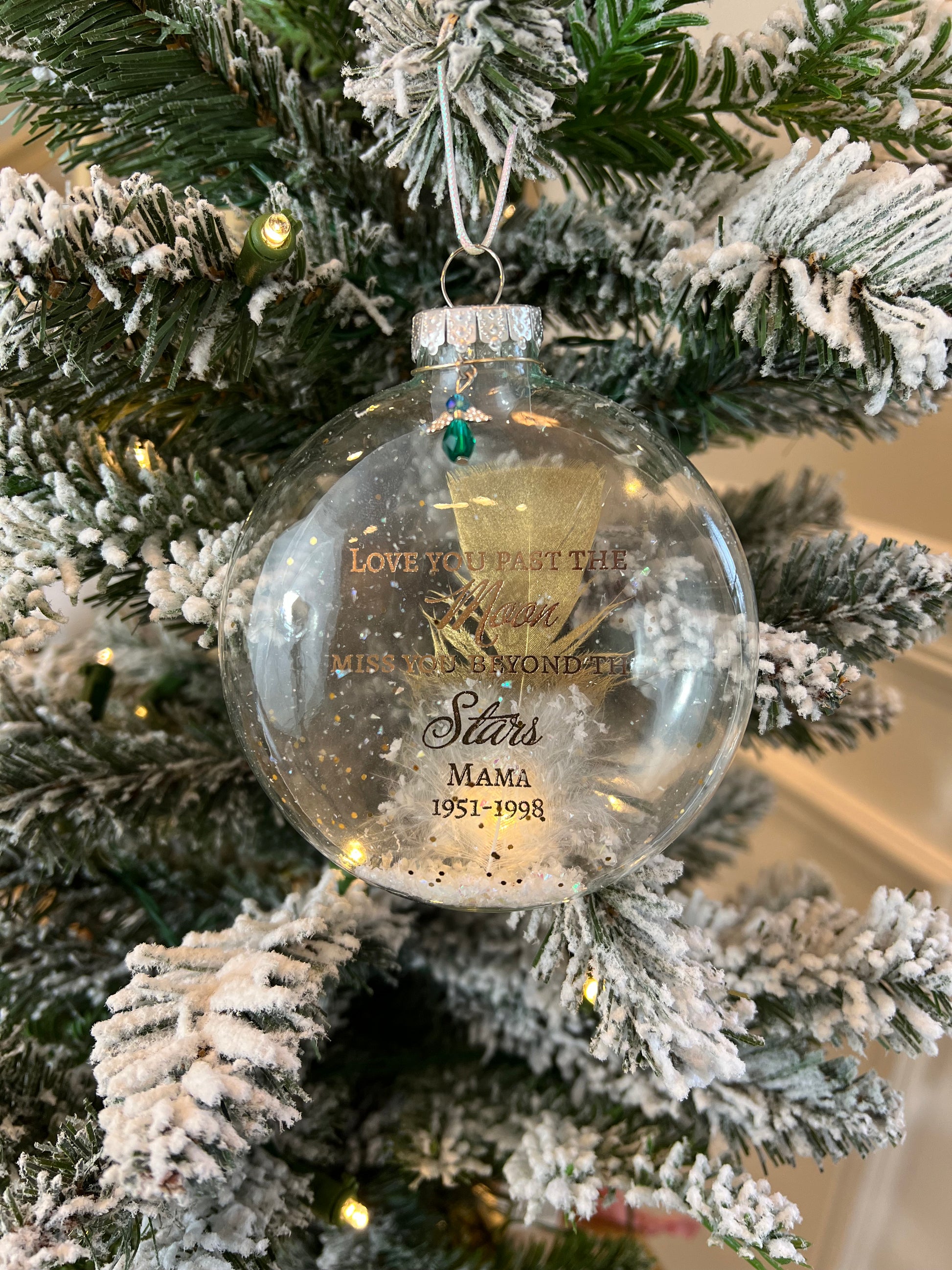 view of silver metallic braided cord and angel charm on memorial ornament