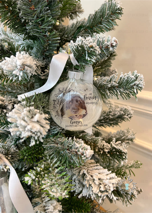Personalized pet memorial ornament with photo, name, years of life, and ribbon for hanging.