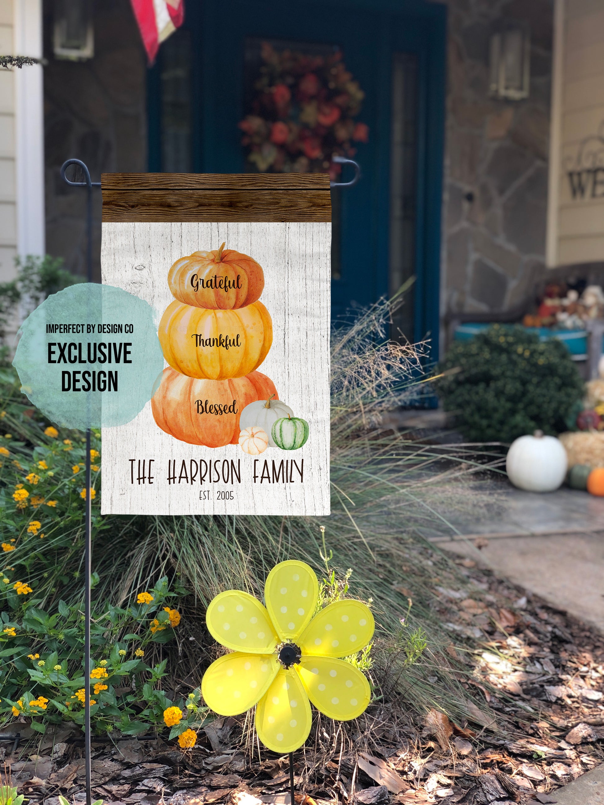 Personalized Thanksgiving garden flag with a pumpkin stack and family name in a rustic autumn design