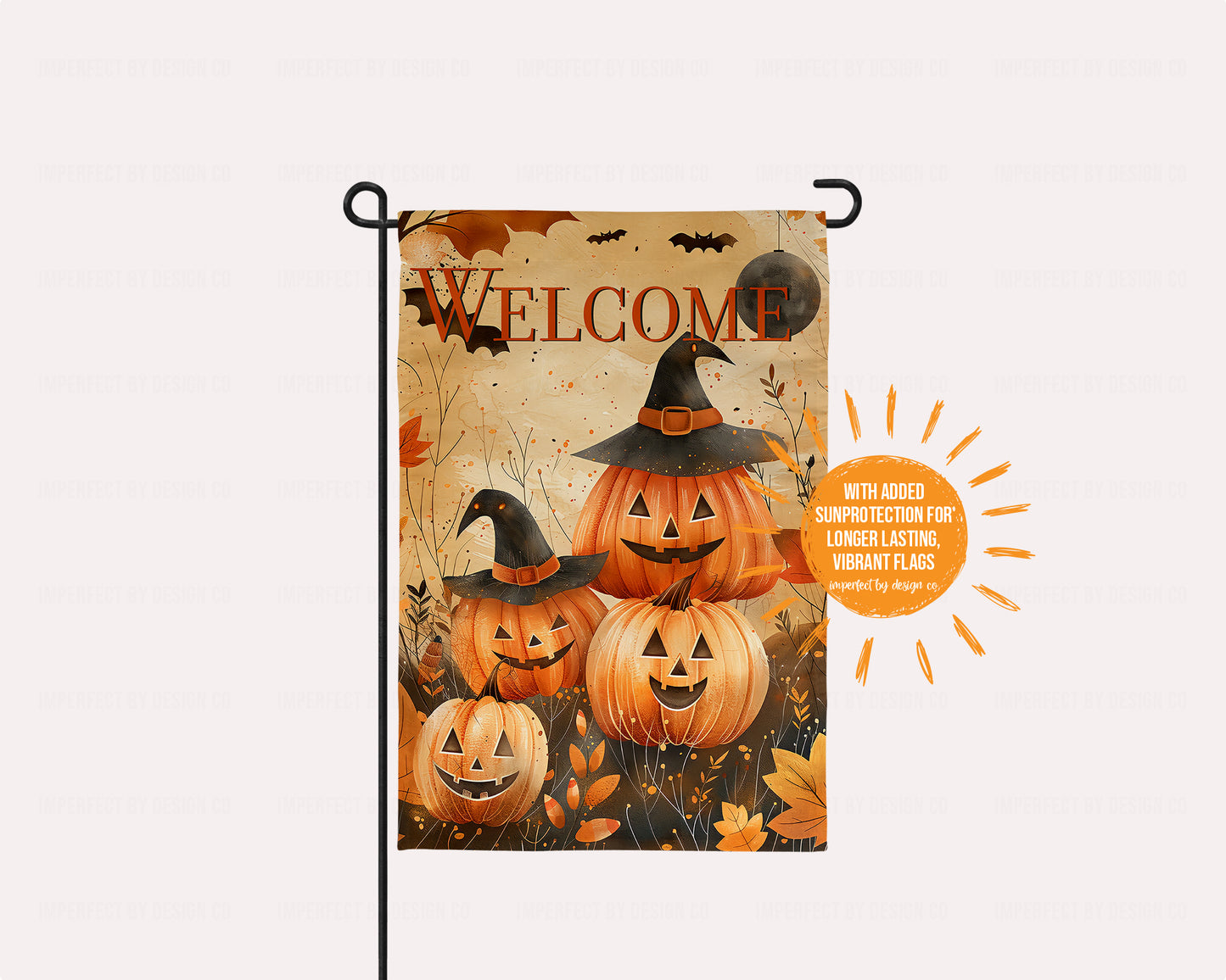 Jack-o-lantern family with two "kids" surrounded by swirling autumn leaves and bats.