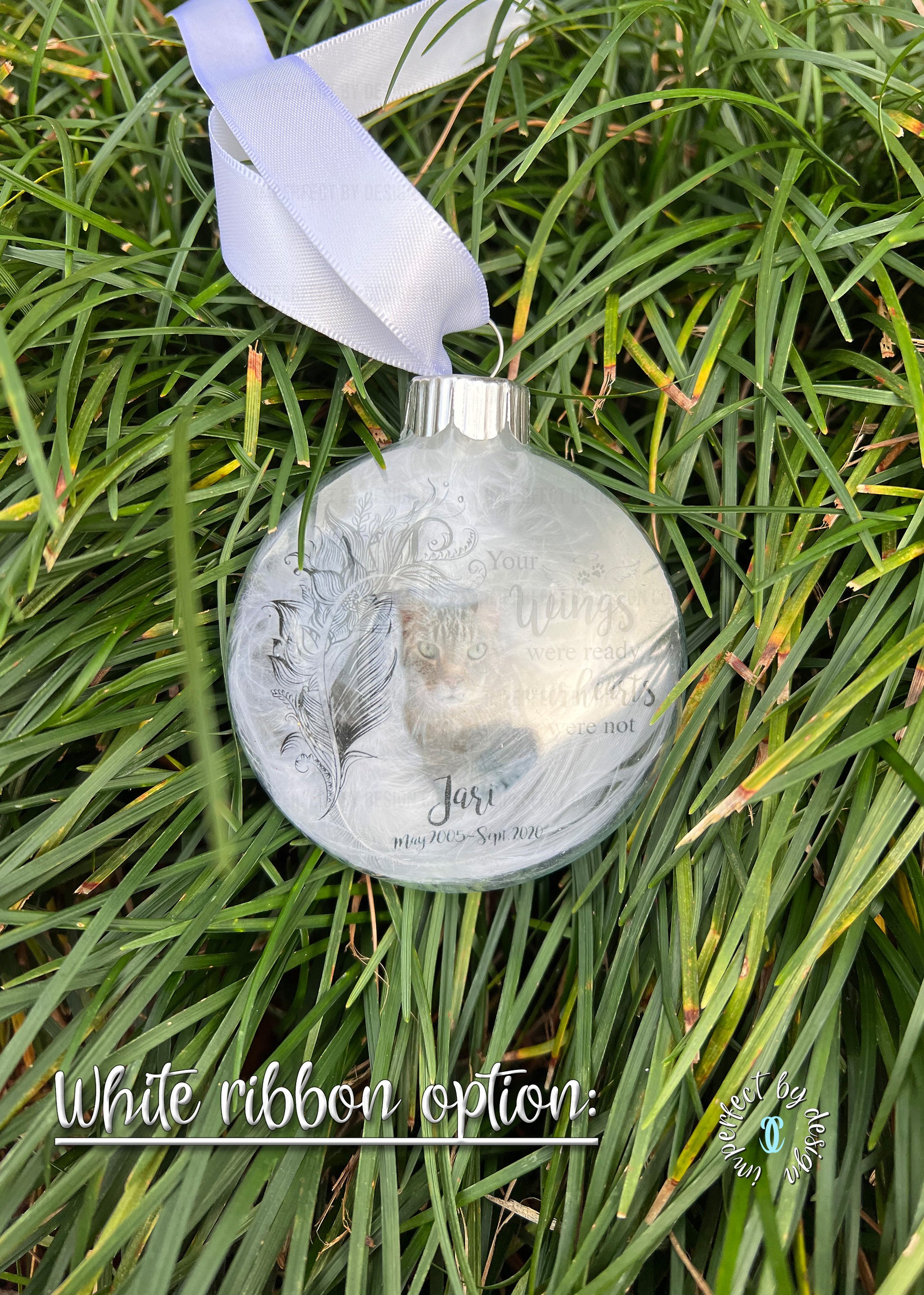Personalized pet memorial ornament with natural feather, pet's name, years of life, and white ribbon option.