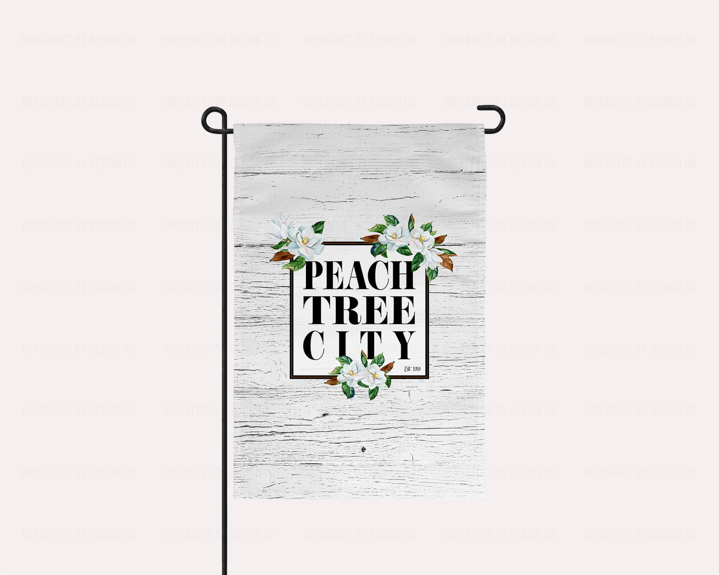 Stunning Magnolia, Peachtree City - Garden Flag with an elegant black frame and beautiful magnolia blooms on a white faux wood background. Durable, weather-resistant material for long-lasting use. A must-have for any Southern garden or yard to show off your love for Peachtree City! | imperfect by design co imperfect by design co