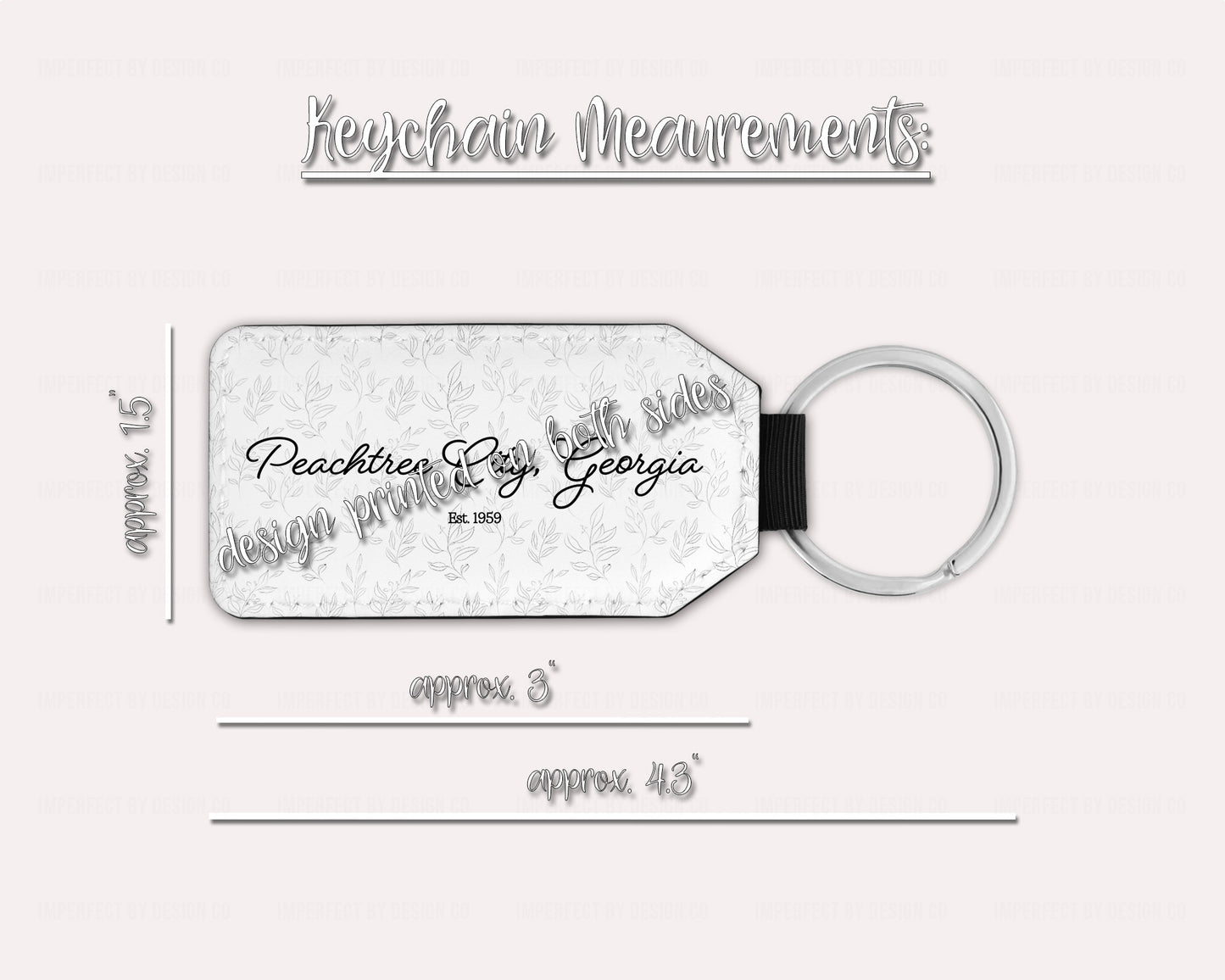close-up photo of a keychain with a whimsical leaves design and the words "Peachtree City Georgia est. 1959" in the foreground. Tab 1 1/2 inches wide by 3 inches long, overall length 4 1/4 inches. | imperfect by design co