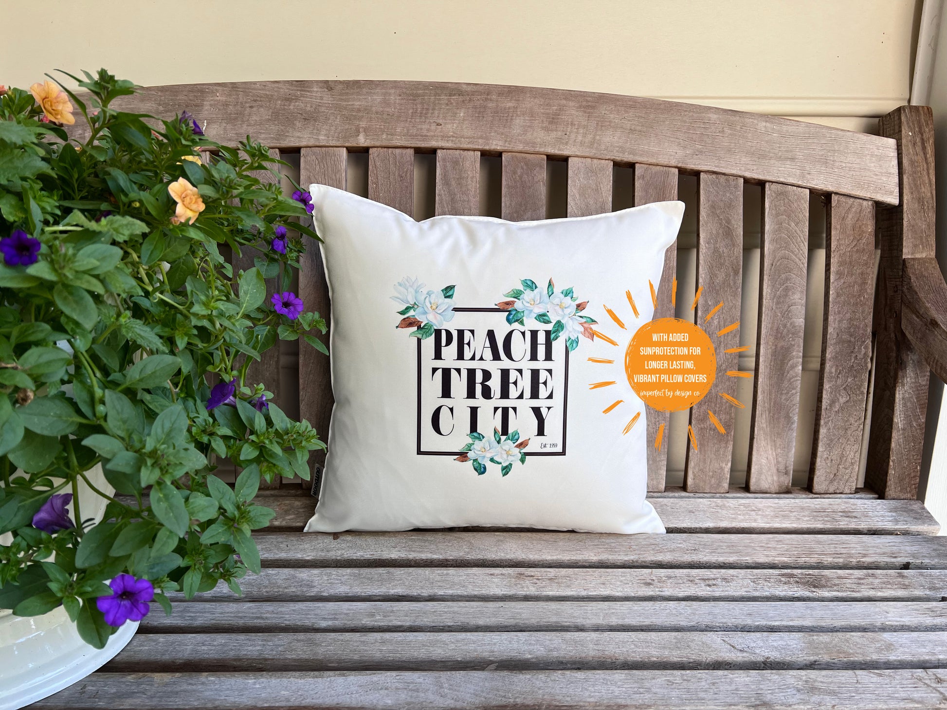Indoor Outdoor Pillow cover with Magnolia motive in frame that reads "Peachtree City est. 1959" 