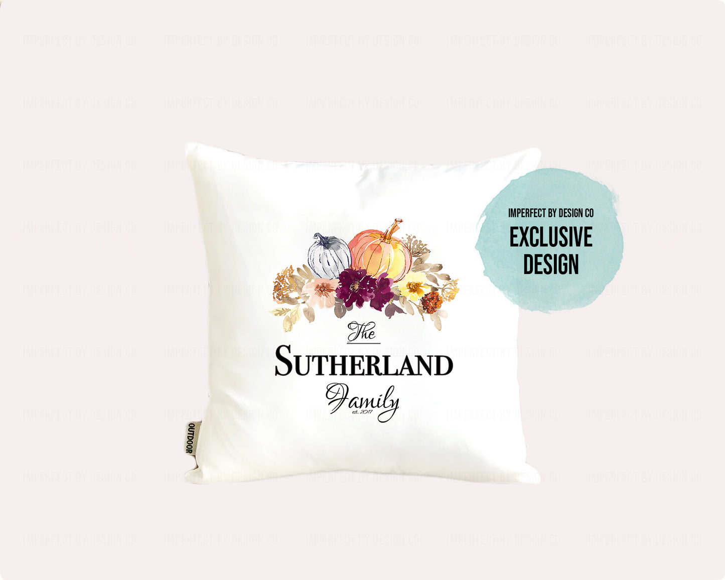 Decorative pillow (cover)  with 'The Sutherland Family' text, pumpkins and floral design on a pale pink background
Text blurb reads imperfect by design co exclusive design