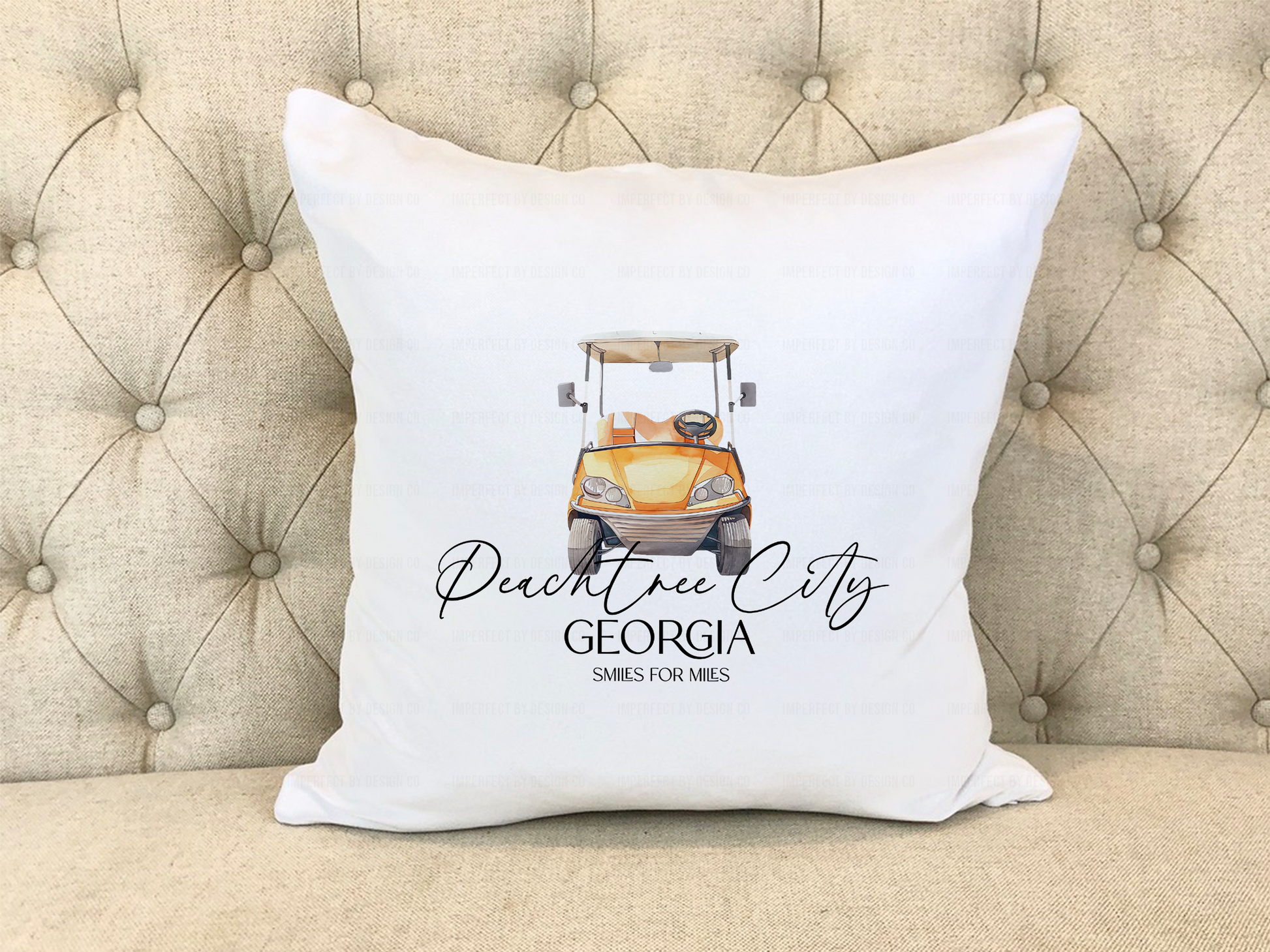 Front view of an orange golf cart with “Smiles for miles” text on the pillow cover.
