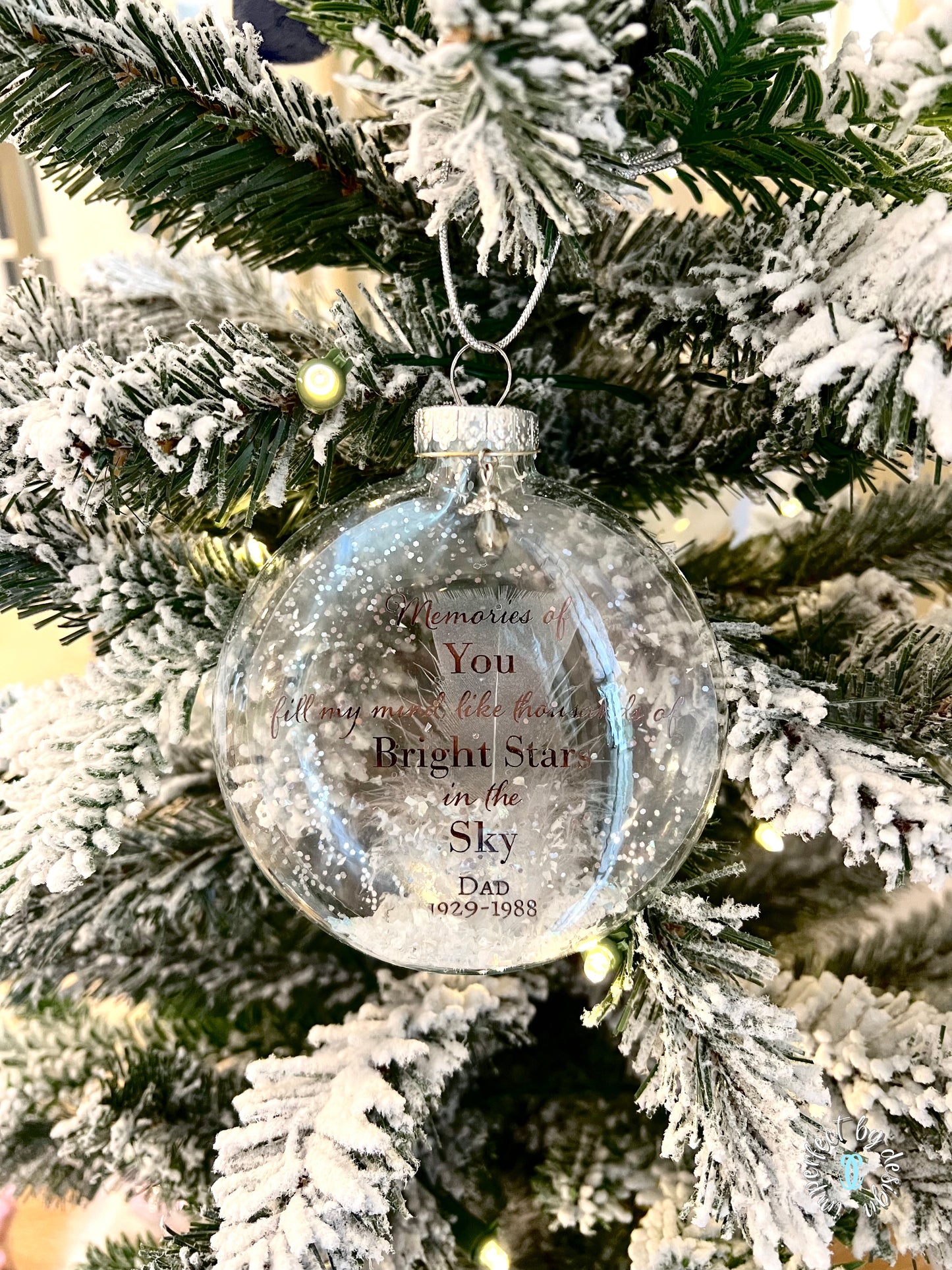 Memorial Ornament displayed on a Christmas tree, featuring custom name and life dates.