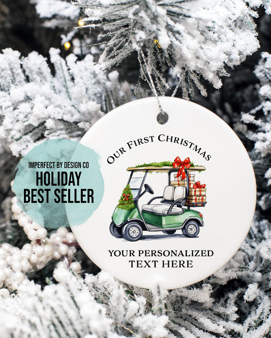 Personalized Christmas Polymer Ornament Green Golf Cart with Christmas Present and Red Bows Placed on Festive Green Garland Text Reads "Our First Christmas" Our Best Selling Ornaments| exclusive imperfect by design co design