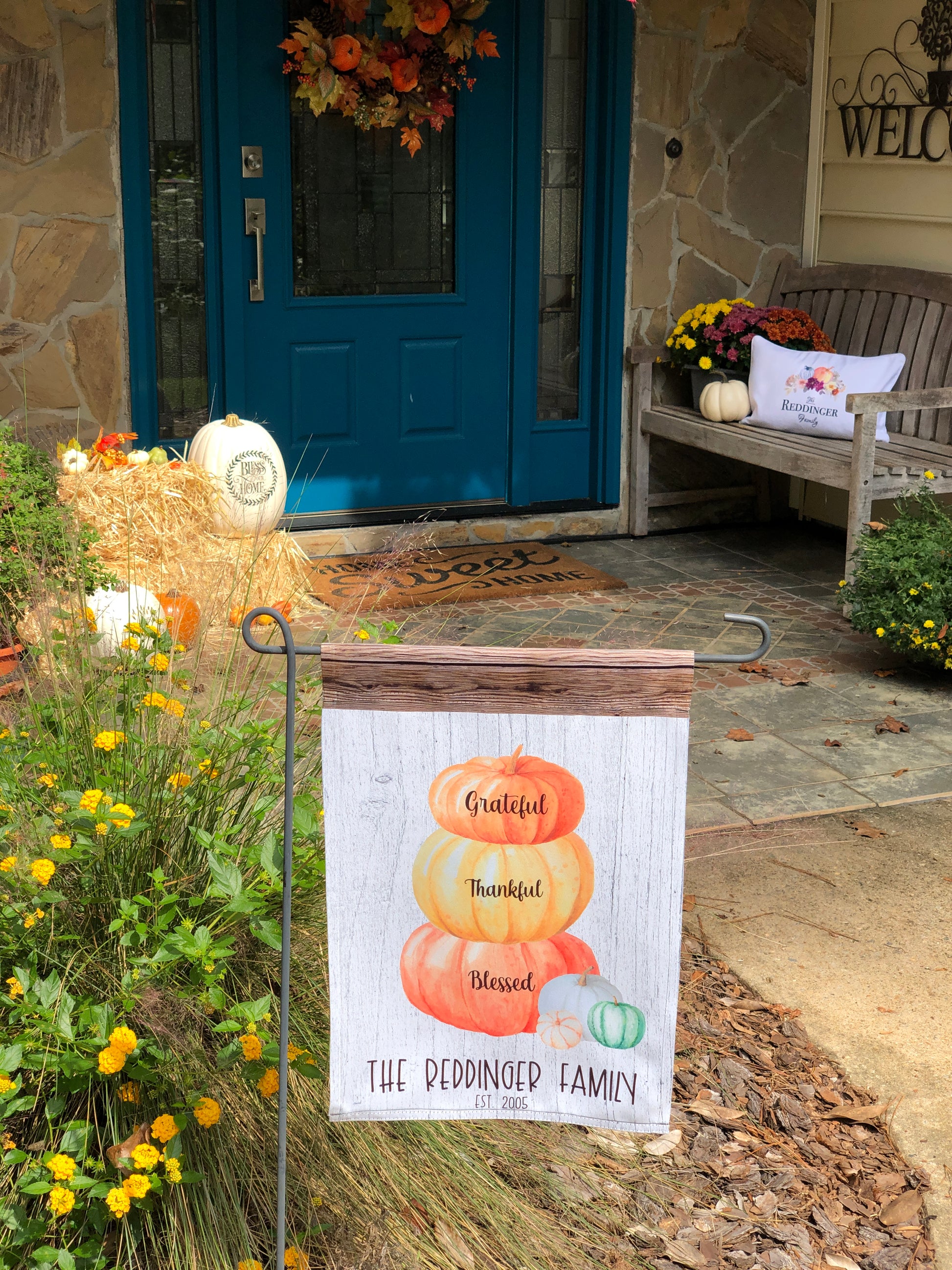 Custom fall garden flag with a pumpkin stack, white and brown wood background, and personalized family details