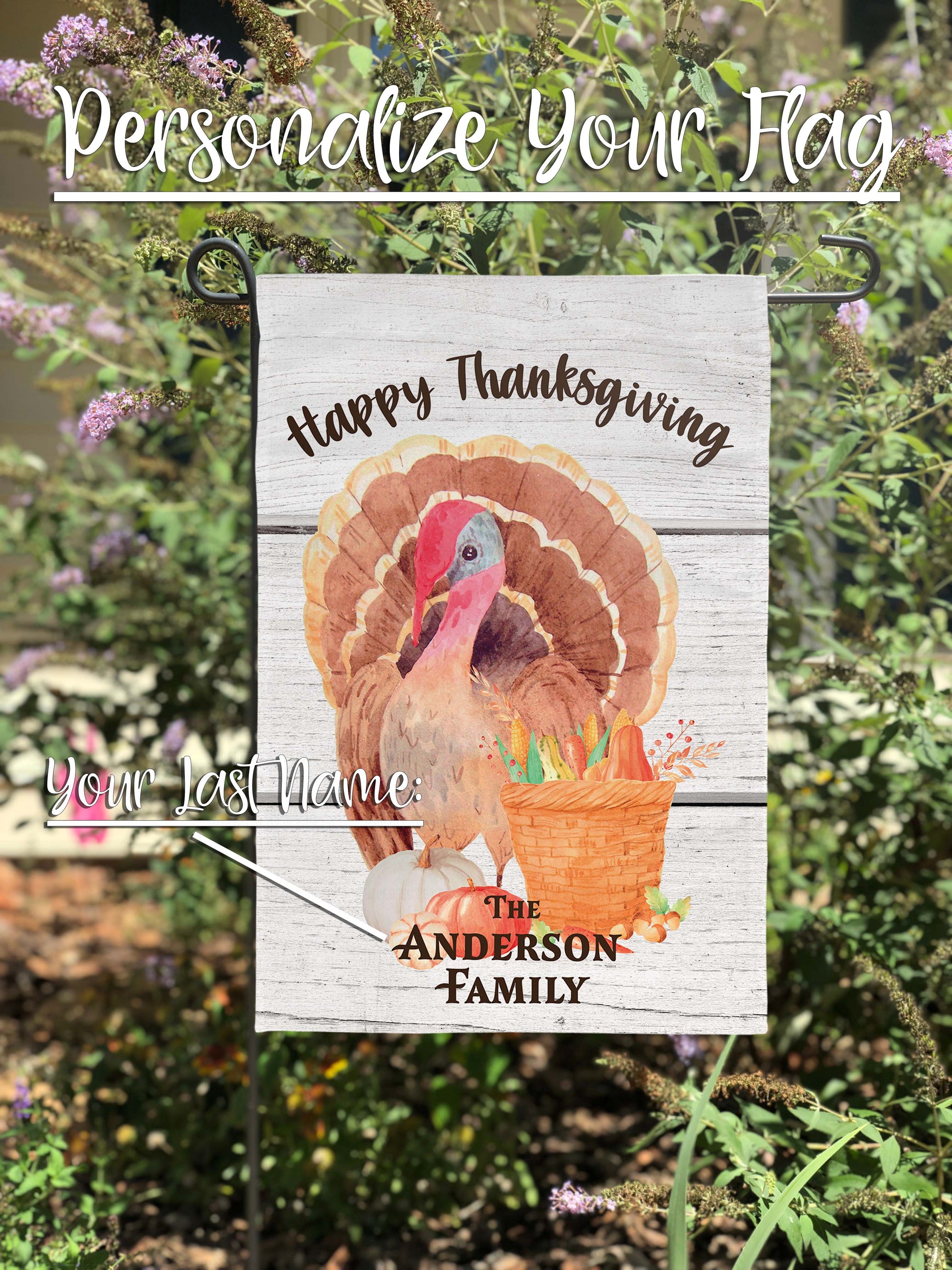 Detailed view of the turkey and gourds on the Thanksgiving-themed garden flag.