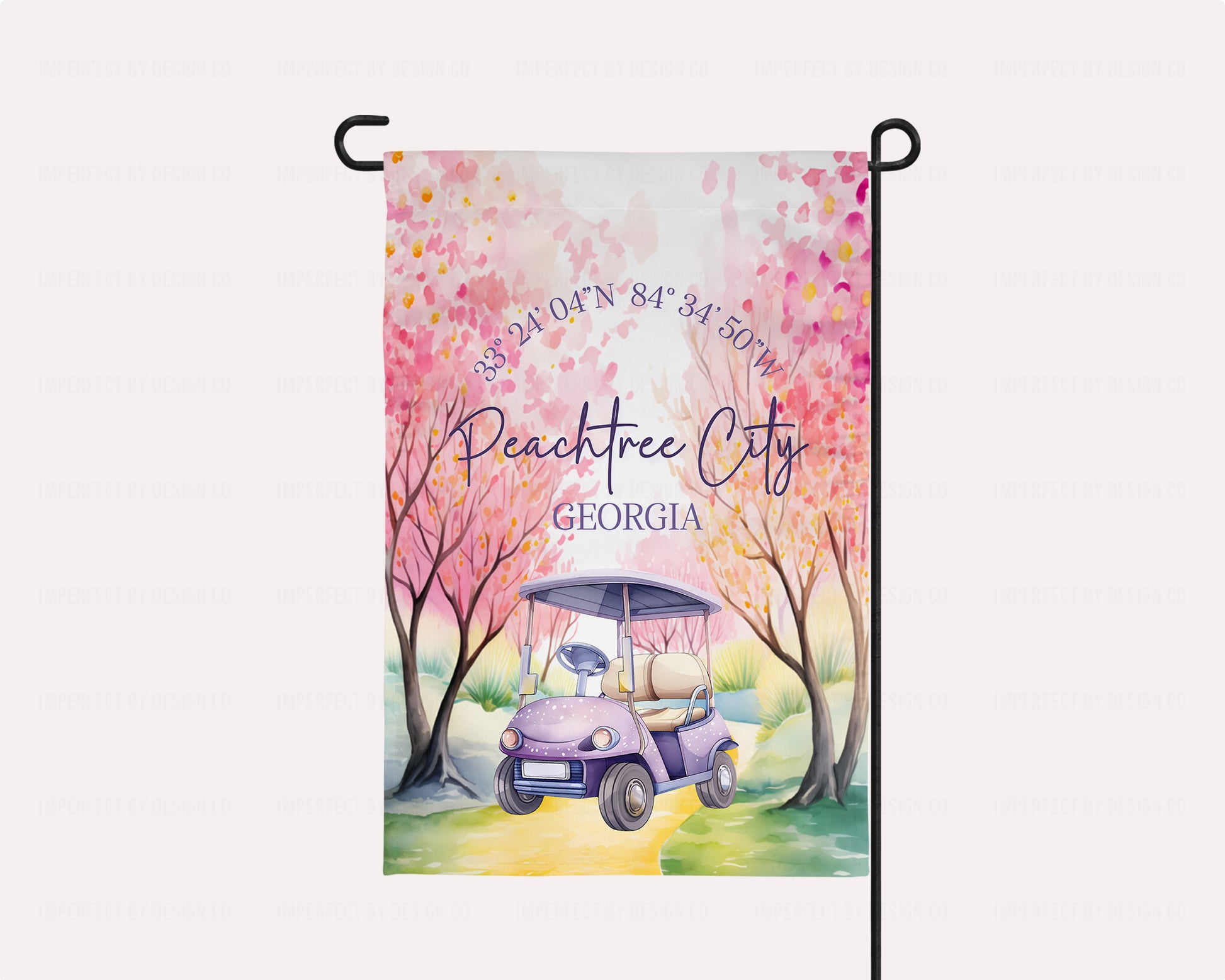 Decorative garden flag with a golf cart and cherry blossom trees design, featuring the text 'Peachtree City, Georgia'.