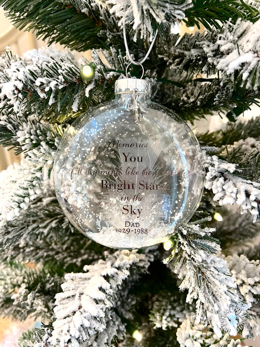 Glass memorial ornament with the phrase "Memories of you fill my mind..." and angel charm.