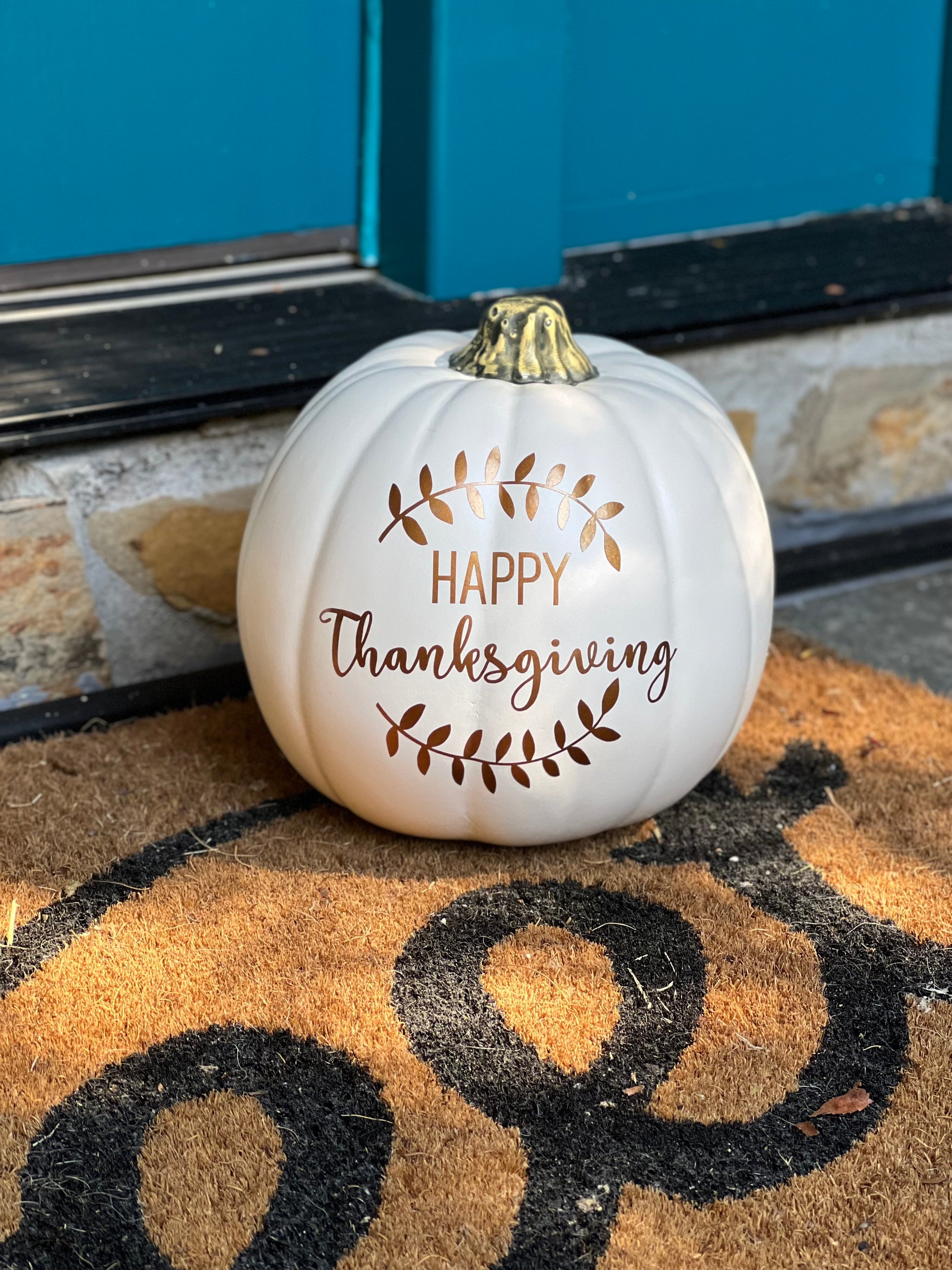 Faux pumpkin with Happy Thanksgiving text in bronze and laurel design
