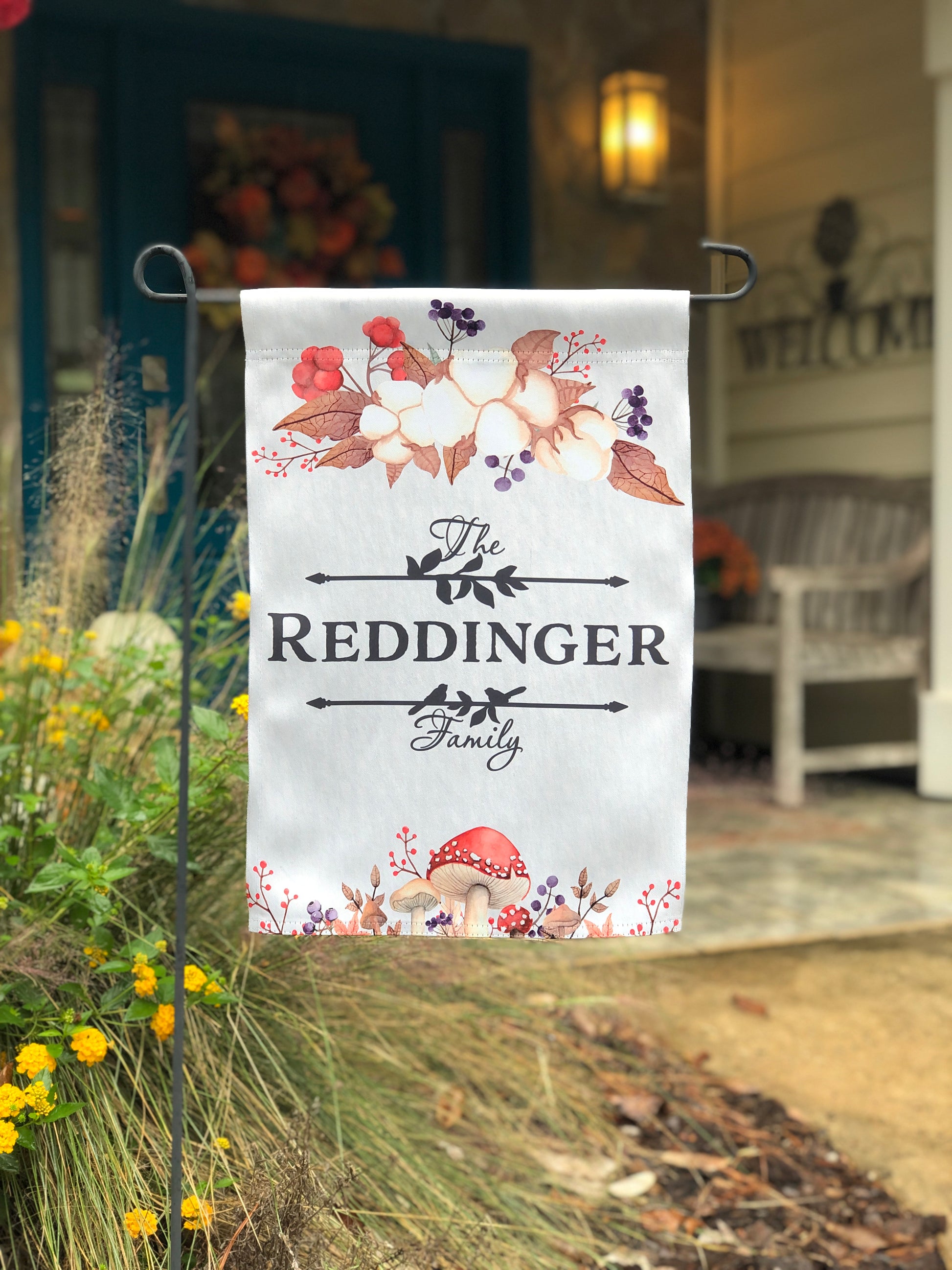 Custom fall garden flag featuring mushrooms, foliage, and "The [Last Name] Family" text.
