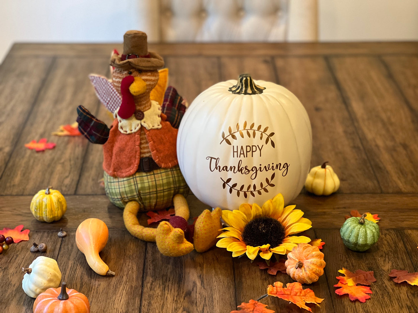 Medium size white decorative pumpkin "Happy Thanksgiving" text in bronze on festive table setting