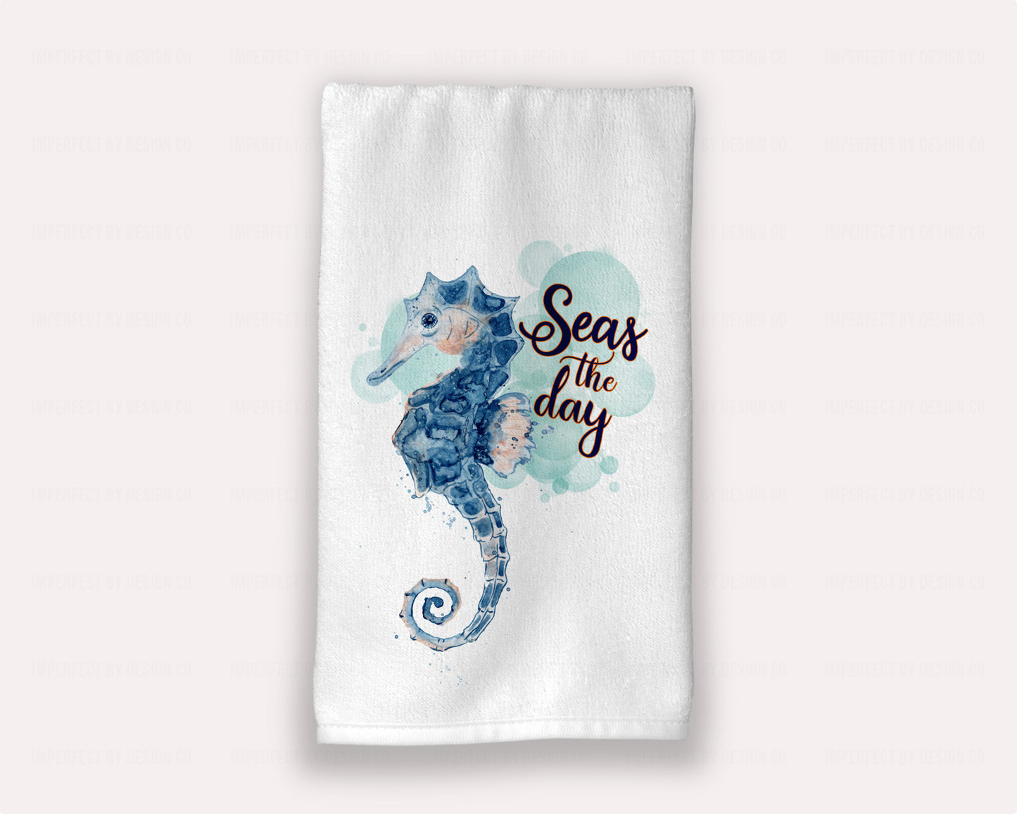 Luxurious white guest hand towel from the Coastal Vibes Collection with watercolor seahorse, “Seas the day” | imperfect by design co
