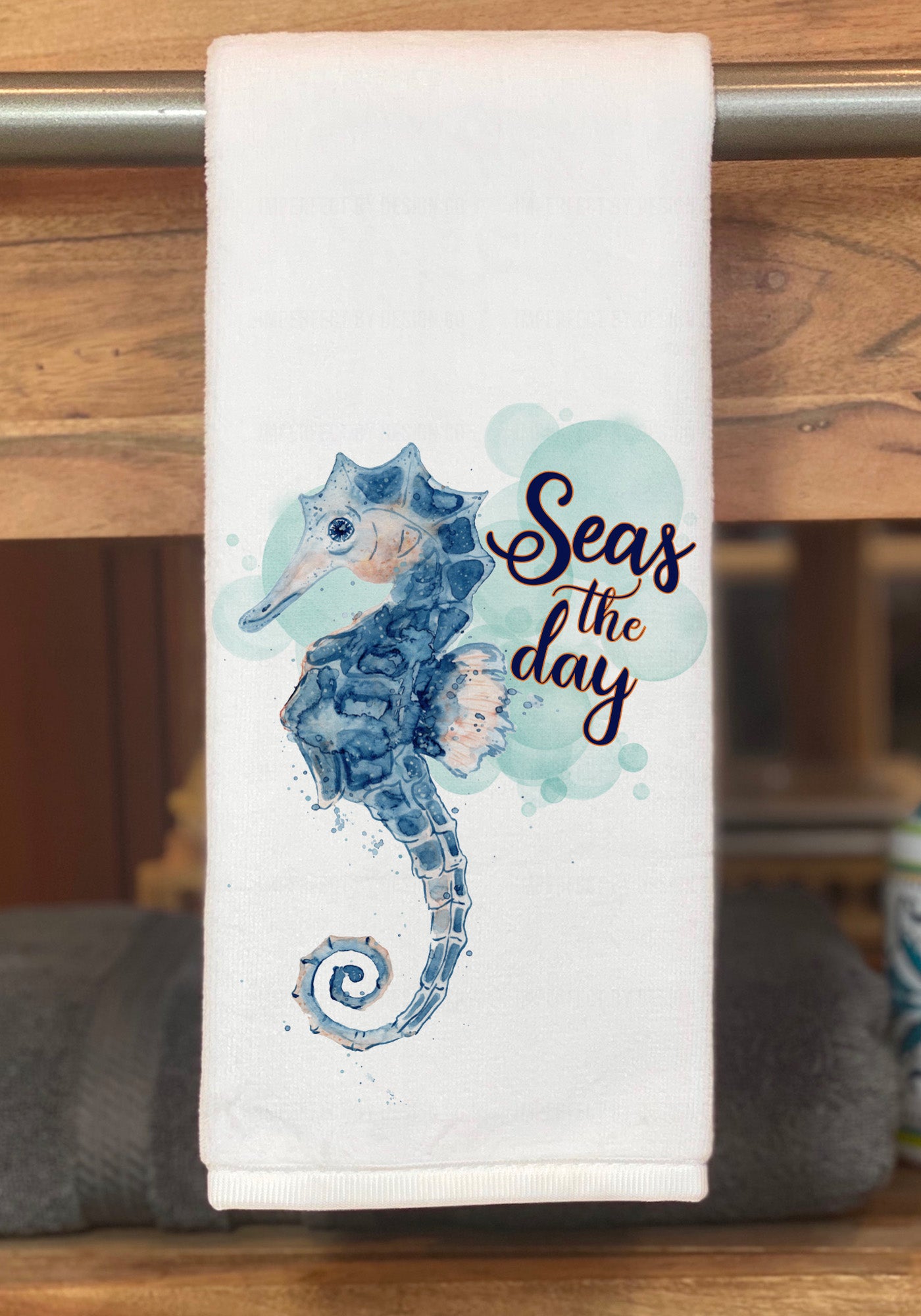 Elegant watercolor-style seahorse design with "Seas the day" script font on luxurious white hand towel | imperfect by design co