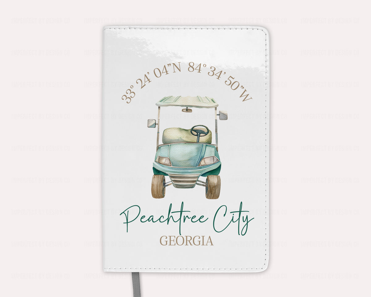 Notebook with a golf cart illustration and text on a pale pink background
imperfect by design co exclusive design