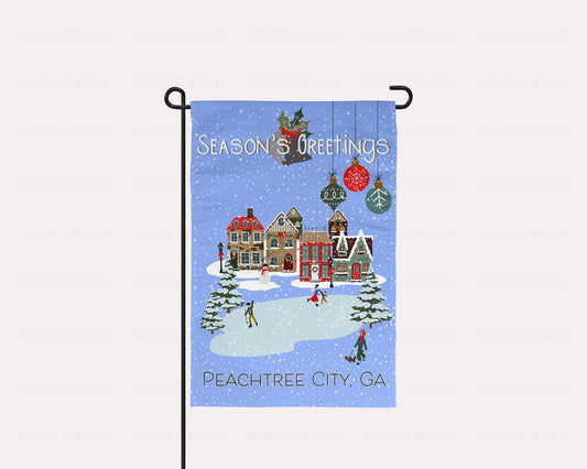 Double-sided Season's Greetings garden flag with winter village scene and ice skating pond | imperfect by design co