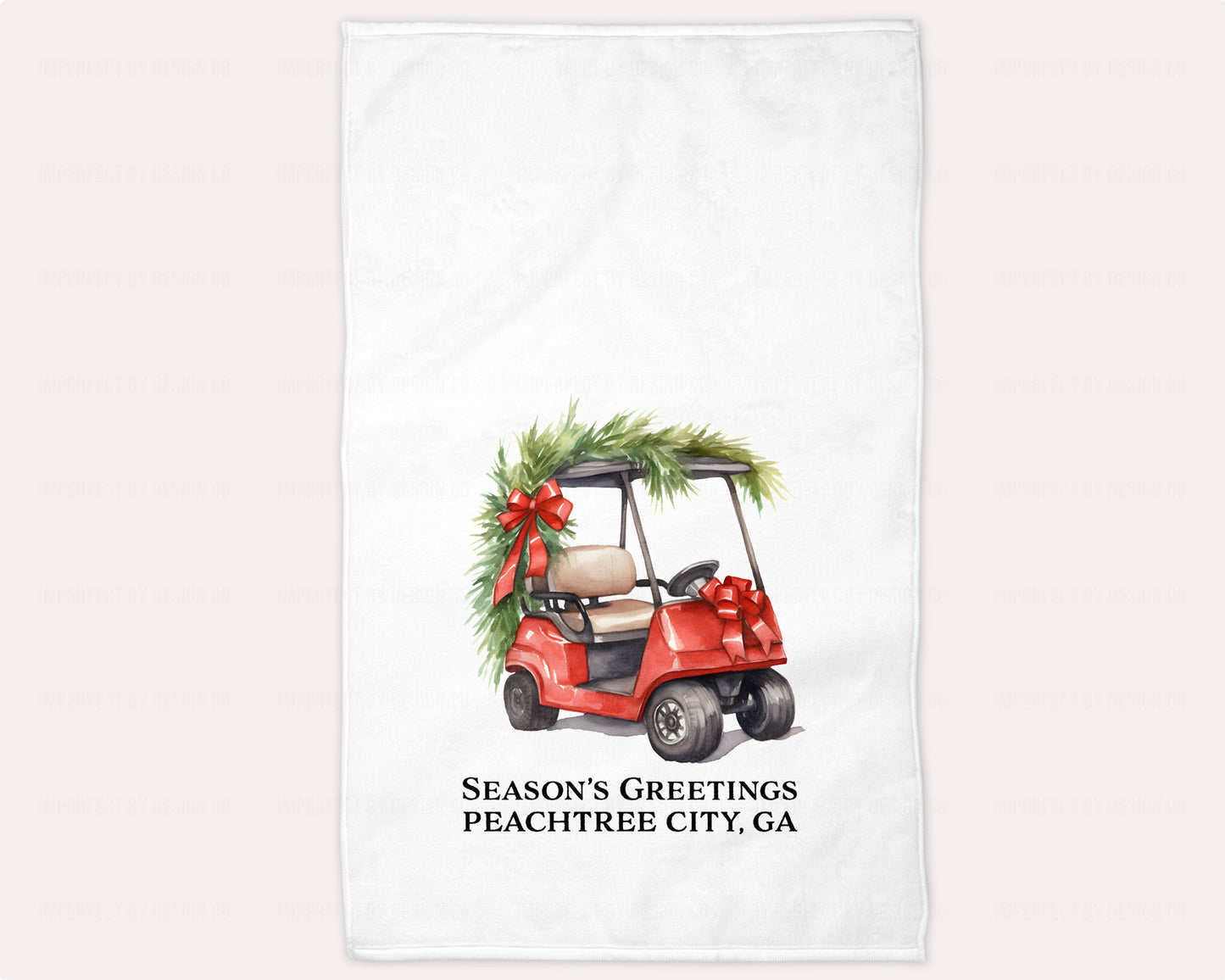 White 15x25 guest towel with red Christmas golf cart and Season’s Greetings text