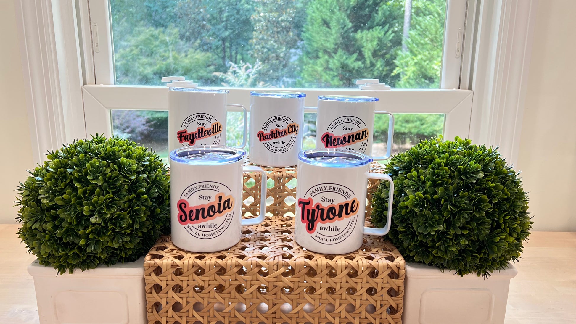 Collection of Camper Mugs showcasing a variety of Fayette County Georgia Cities (Senoia, Tyrone, Fayetteville, Newnan, Peachtree City" Stay awhile design". 