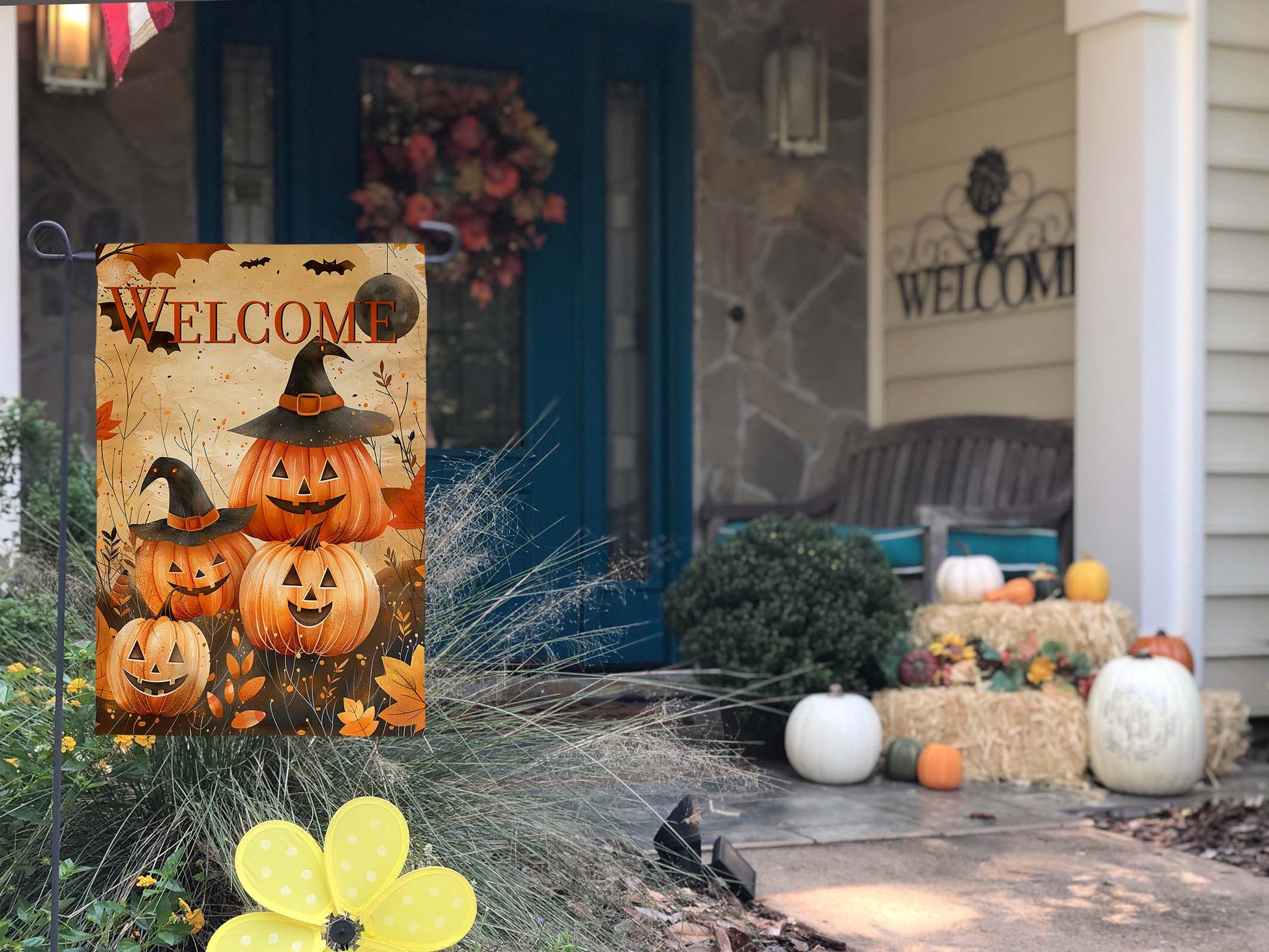 Whimsical Halloween garden flag with playful bats and "WELCOME" text in a festive design.
