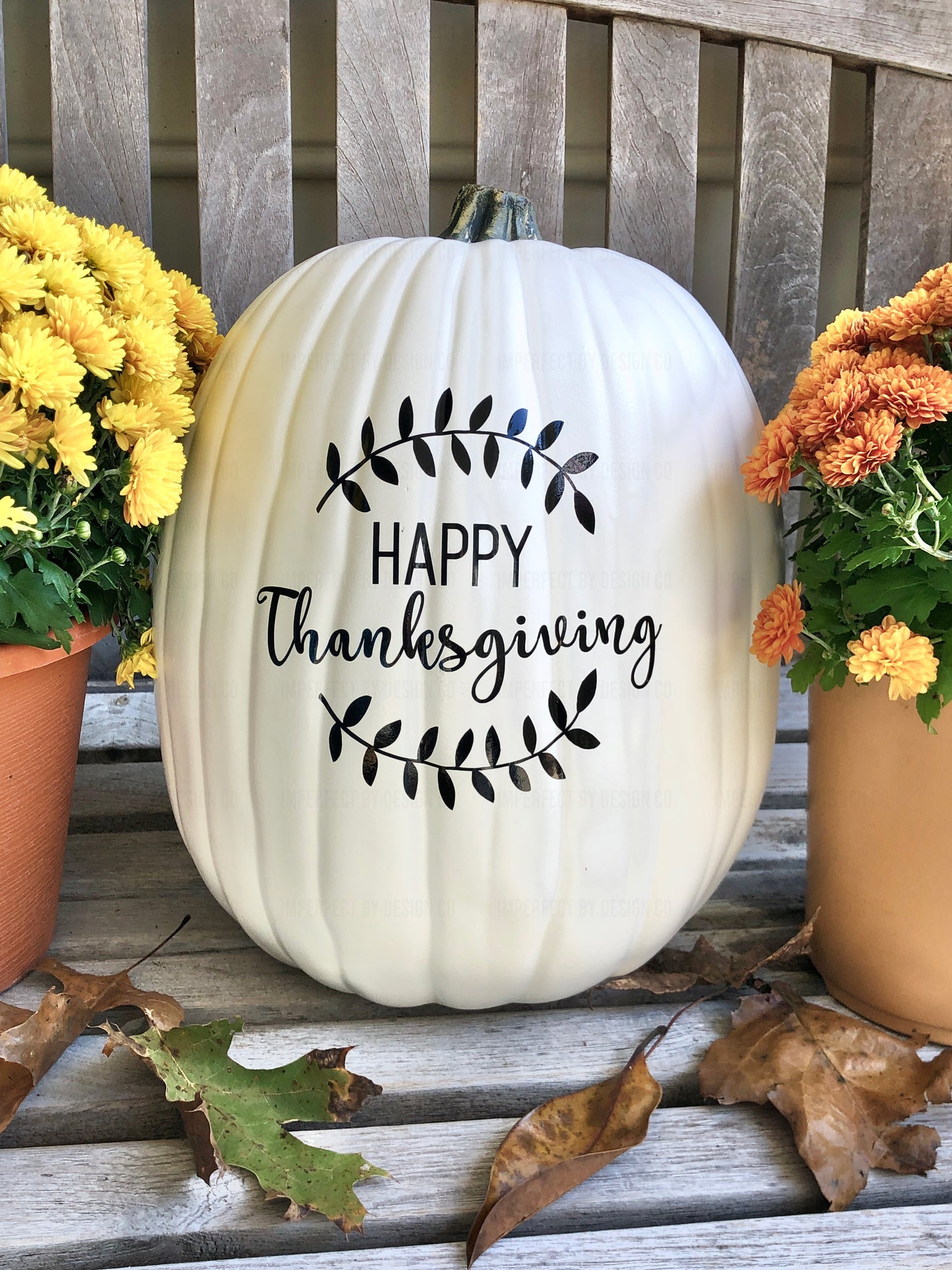 Large decorative faux pumpkin with Happy Thanksgiving text with Laurel in black