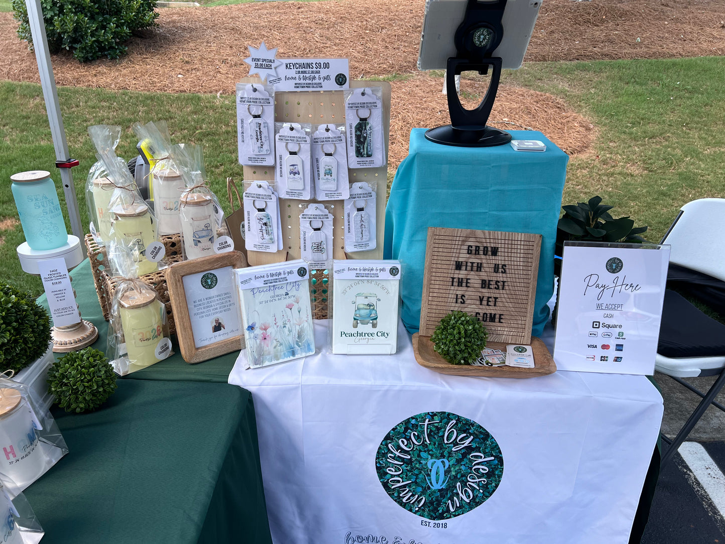 Peachtree City Line Creek Brewing Co Vendor Market, imperfect by design co products in market setting. Key Chains, Color Changing Tumblers, Notebook /Journals 