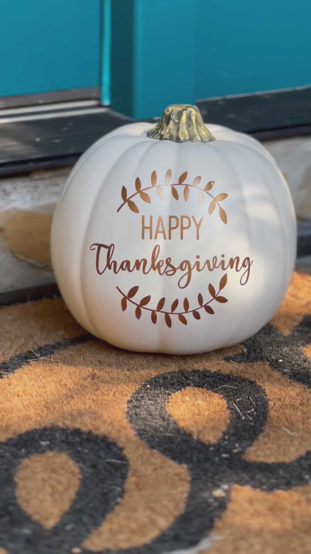 video still of white decorative pumpkin "Happy Thanksgiving" in bronze text