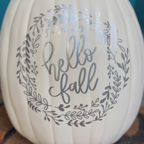 video still of large white decorative pumpkin with silver text "hello Fall