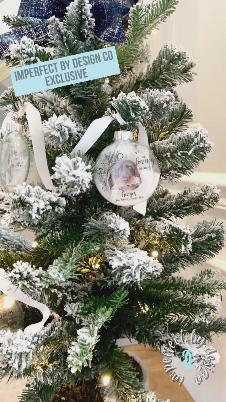 Video still of Pet memorial ornament with customizable photo, name, and ribbon in white, silver, gold, or pink.
