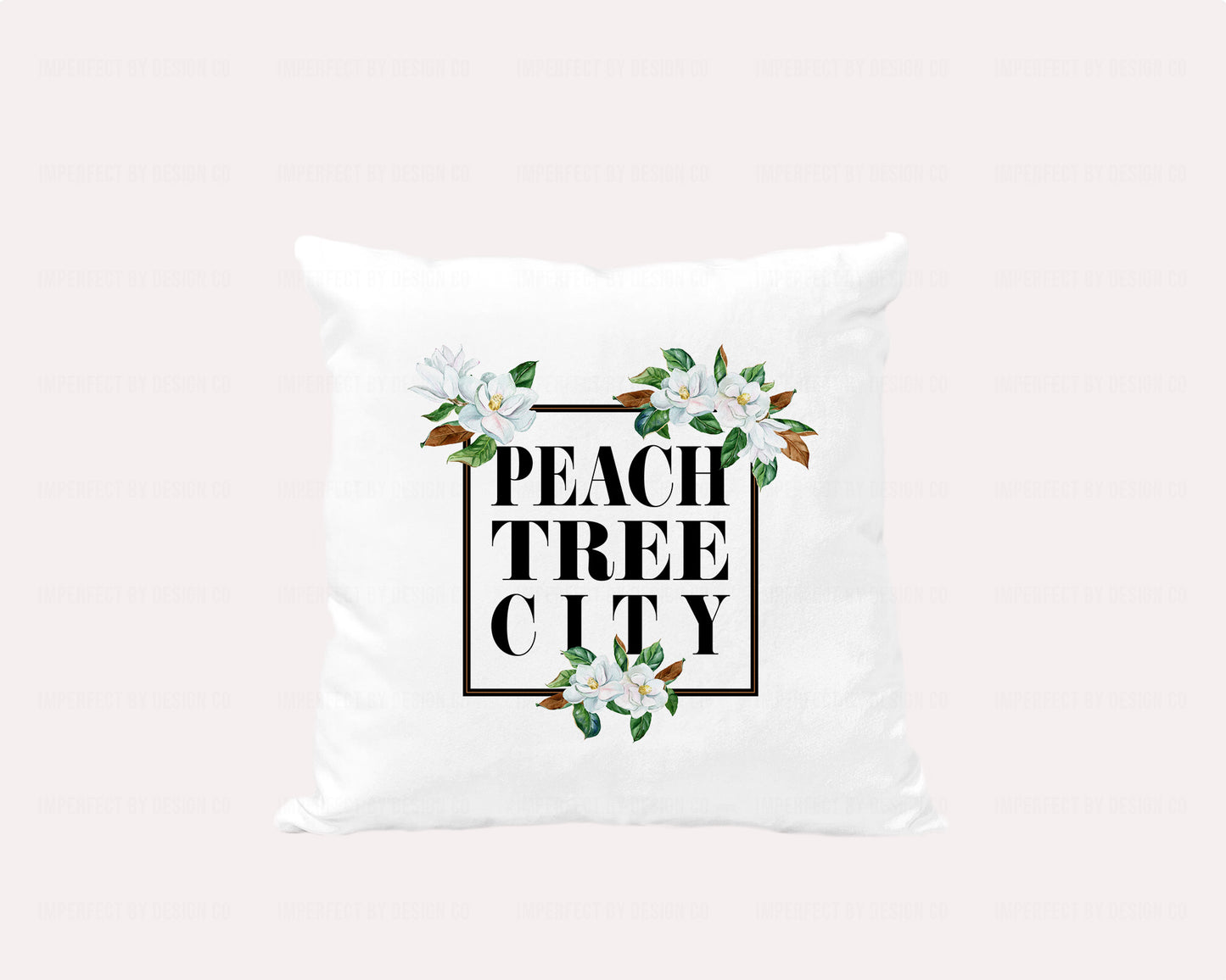 18x18 inches A white velvet pillow cover featuring a stunning graphic with a black frame adorned with magnolia blooms and the words "Peachtree City" inside the frame | imperfect by design co