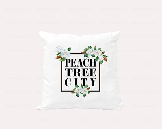 18x18 inches A white velvet pillow cover featuring a stunning graphic with a black frame adorned with magnolia blooms and the words "Peachtree City" inside the frame | imperfect by design co
